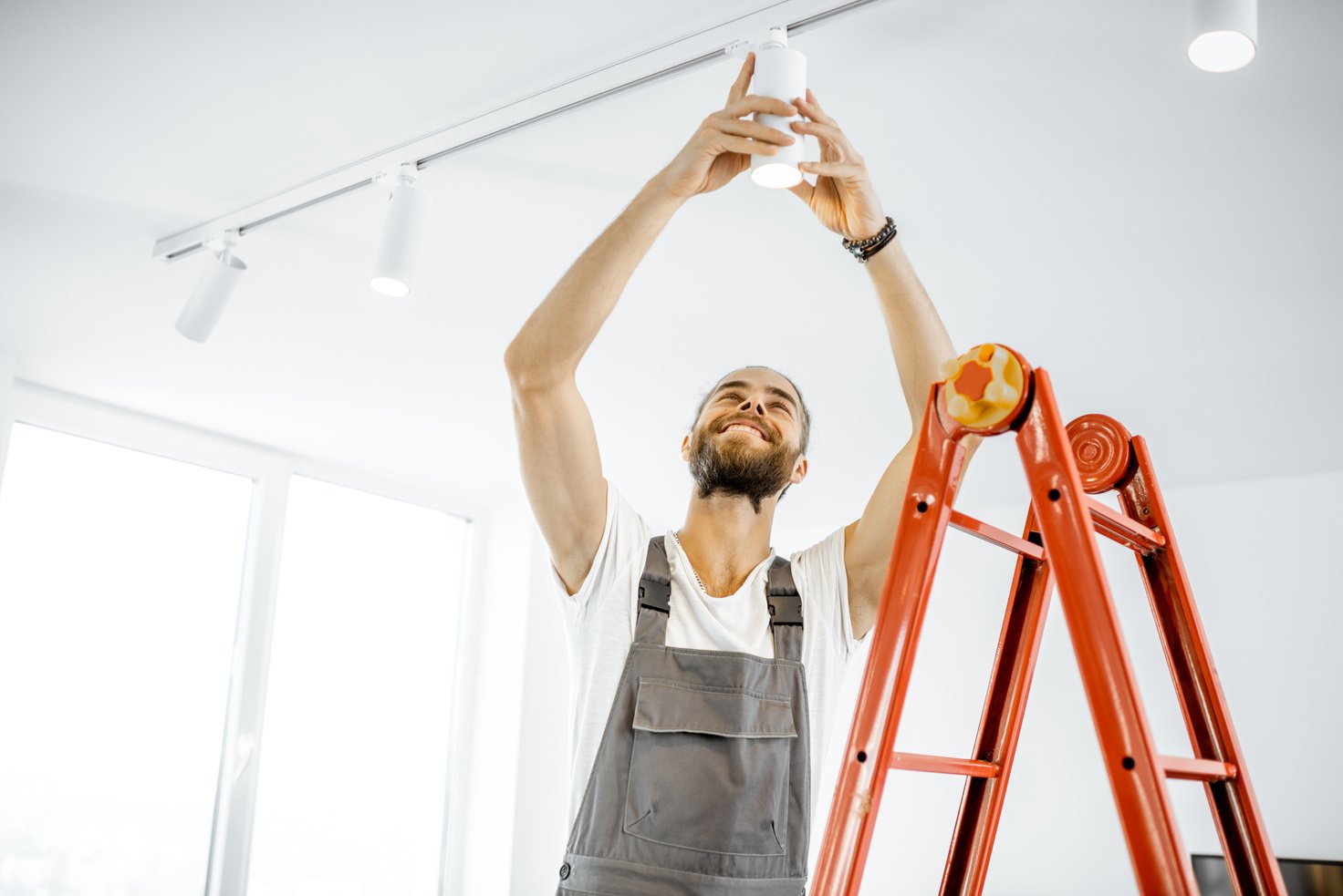 Electrician Installing Light at Home